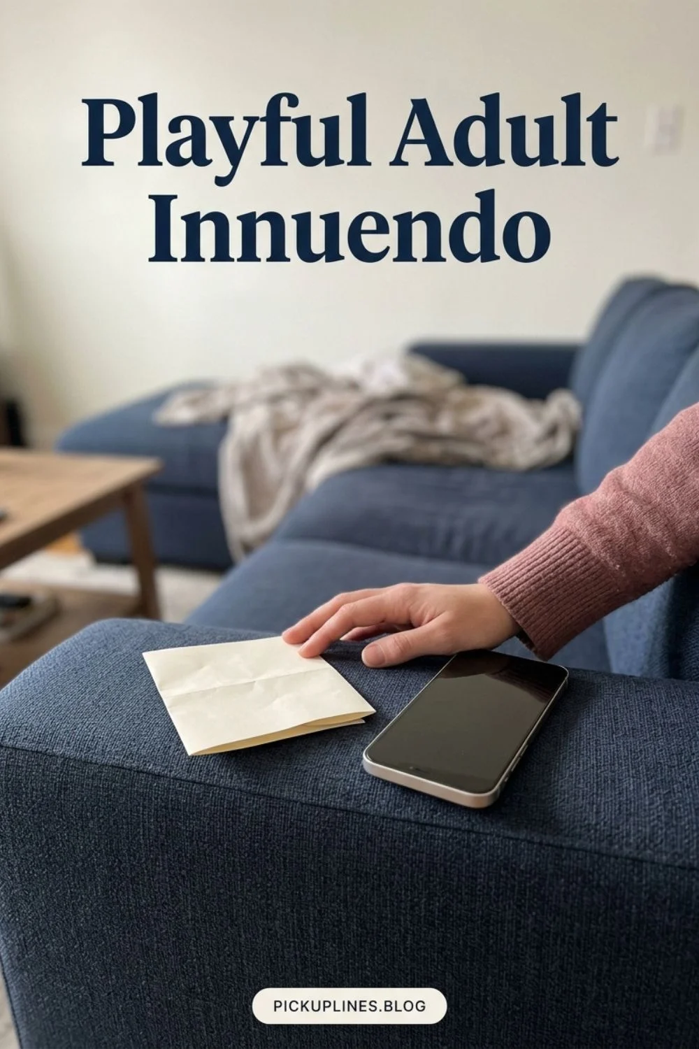 Hands holding a folded note beside a phone on a sofa